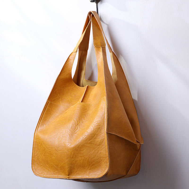 Chic women's oversized vintage leather tote bag, perfect for daily essentials.