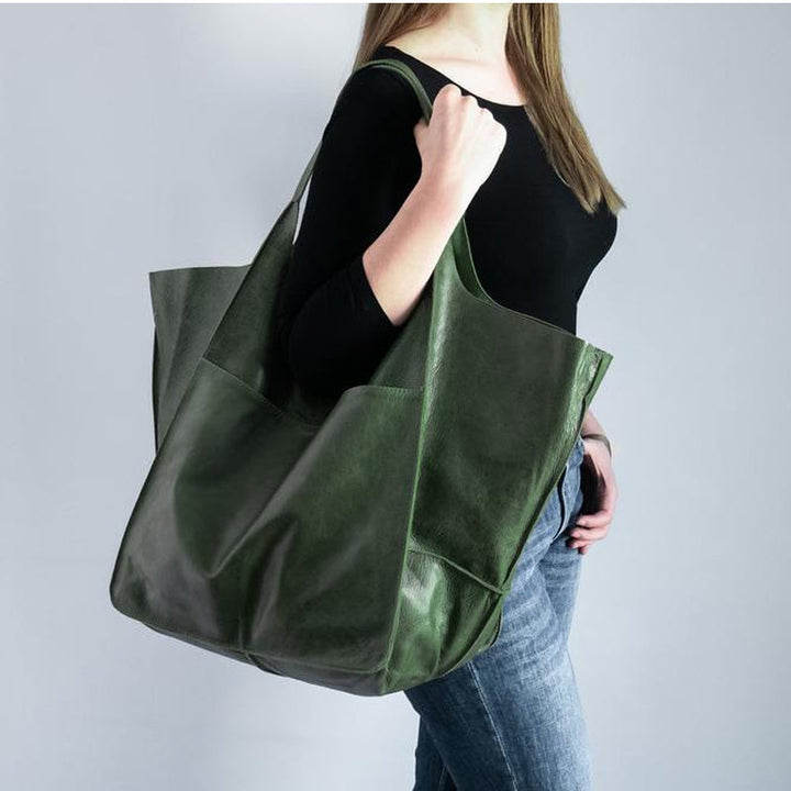Durable women's vintage leather tote, an oversized shoulder bag for everyday use.