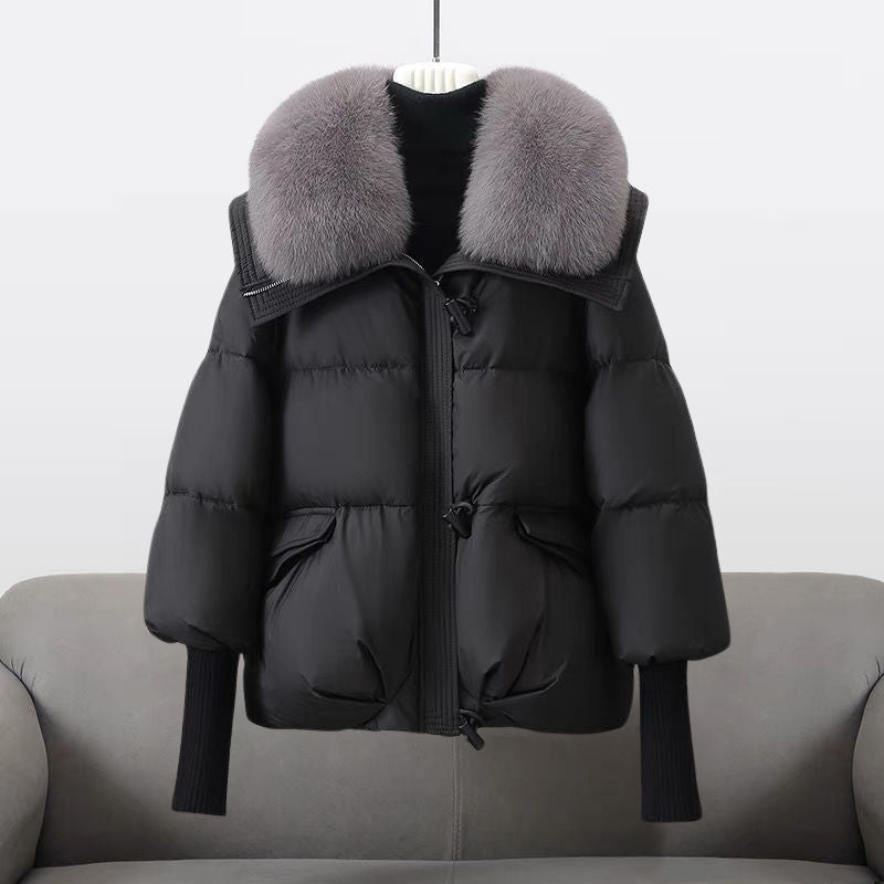 Women's padded winter jacket with a plush fur collar, perfect for cold weather and cozy style.