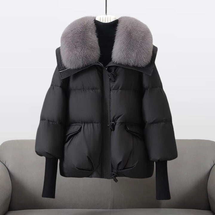 Women's padded winter jacket with a plush fur collar, perfect for cold weather and cozy style.
