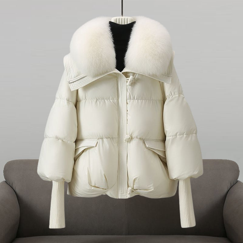Stylish women's warm winter jacket with faux fur collar and secure zipper closure.
