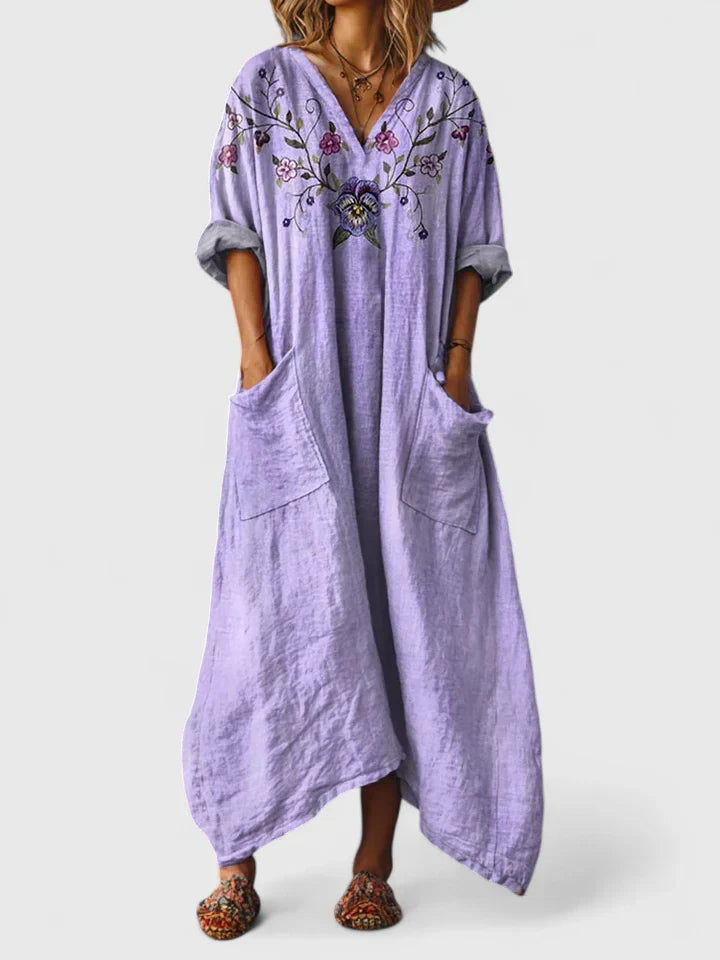 Boho paisley print women's maxi dress featuring a V-neck, oversized fit, and practical patch pockets.