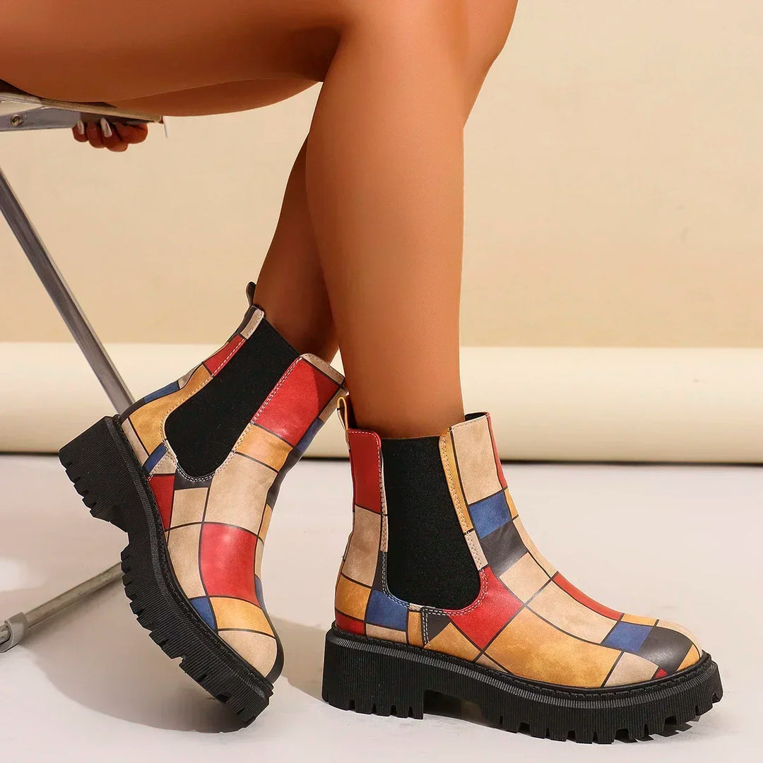 Women's comfortable ankle boots, bohemian patchwork design, and a robust lug sole for outdoor wear.