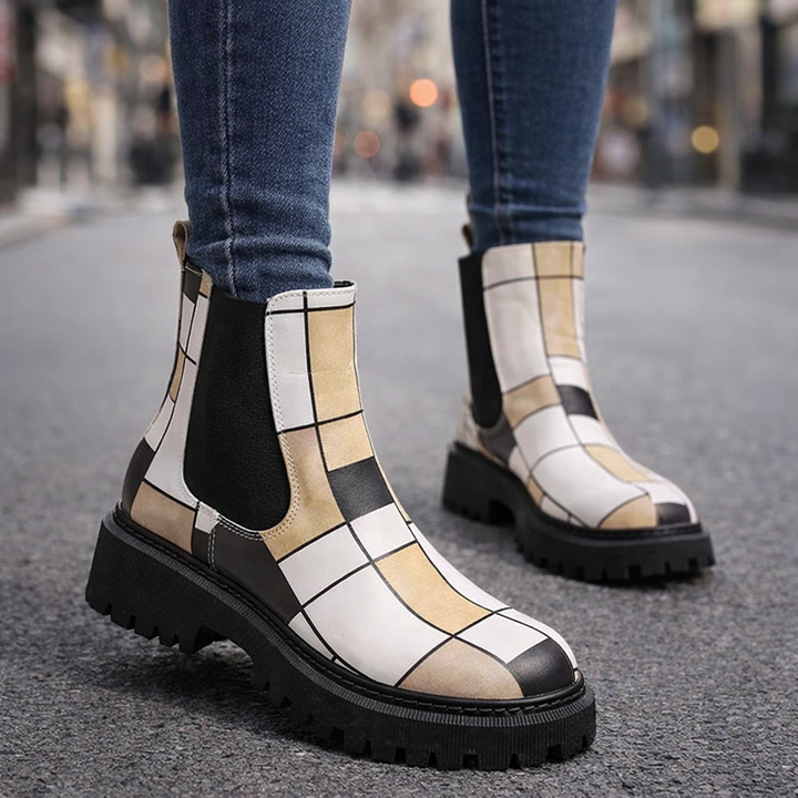 Orthopedic women's ankle boots featuring stylish patchwork and a durable lug sole for comfort.