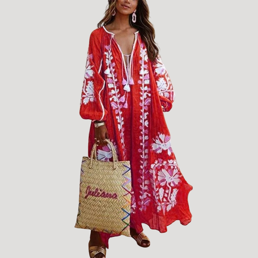 Women's patterned boho maxi dress with a V-neck and long sleeves, featuring a flowing, comfortable fit.