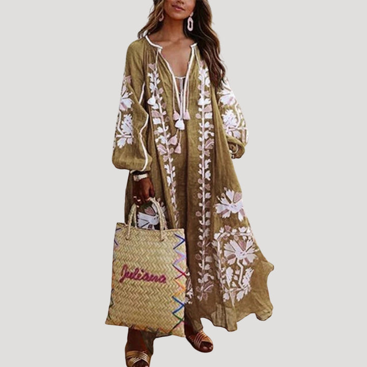 Flowy V-neck patterned maxi dress for women, perfect as a versatile long sleeve bohemian vacation dress.