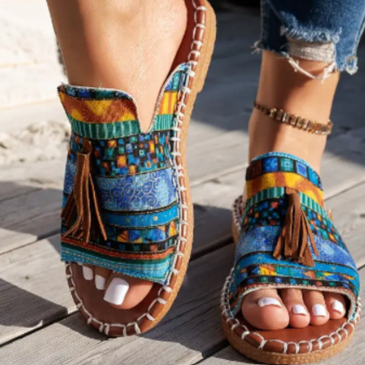 Chic patterned open-toe tassel slide sandals for women. Perfect slip-on for beach, vacation, or summer wear.