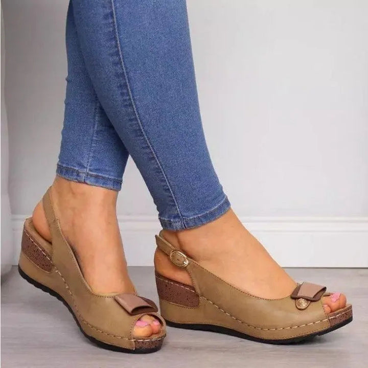 Chic ladies' open toe wedge sandals with a stylish slingback. Ideal for comfortable summer wear.