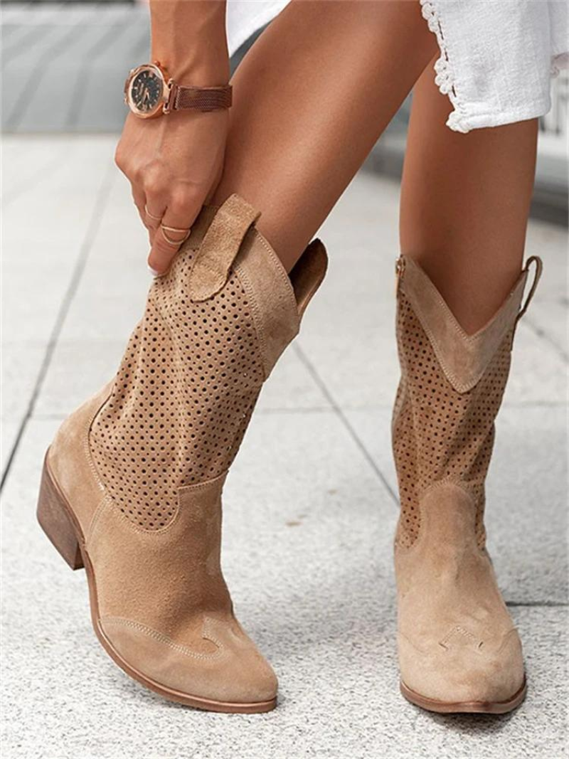 Elegant women's perforated western mid-calf boots, ideal for adding a stylish touch to fall outfits.