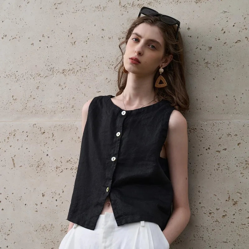 White women's crop top with an asymmetric hem, sleeveless design, and comfortable crew neck.