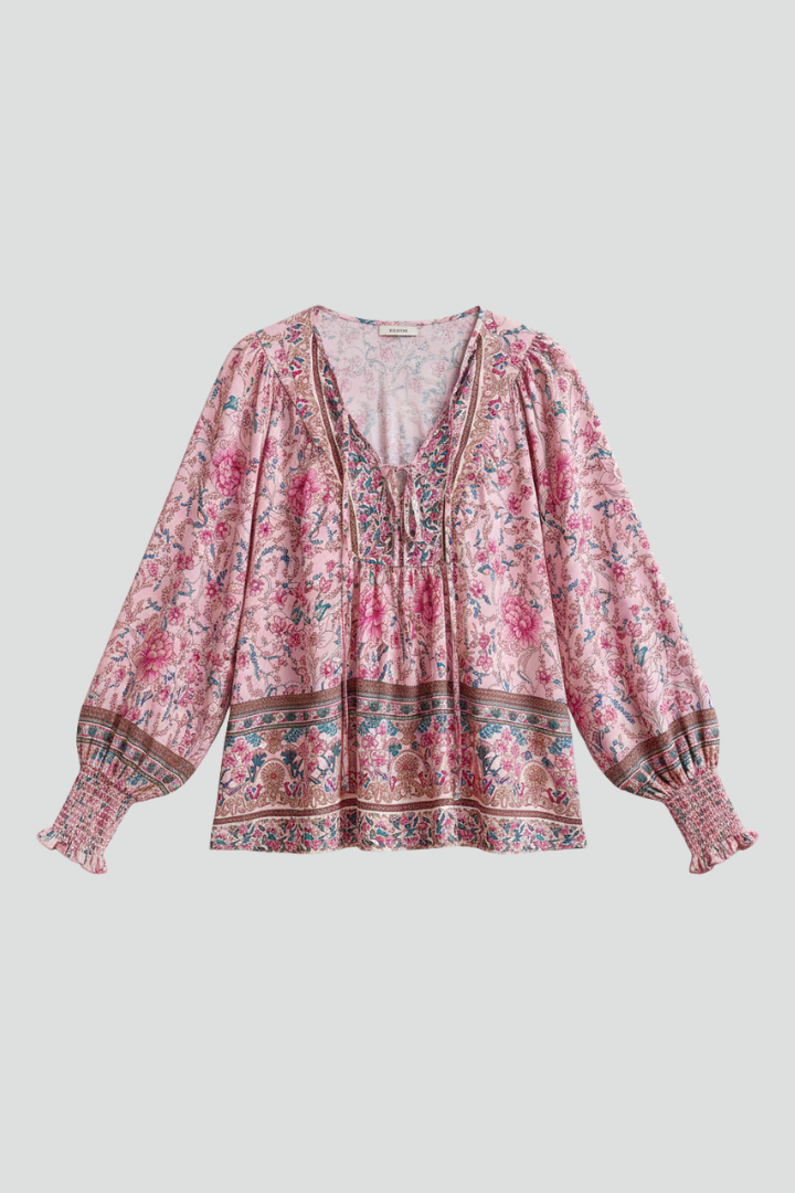 Women's pink floral blouse with long sleeves & V-neck. Loose fit, perfect for casual spring & summer style.