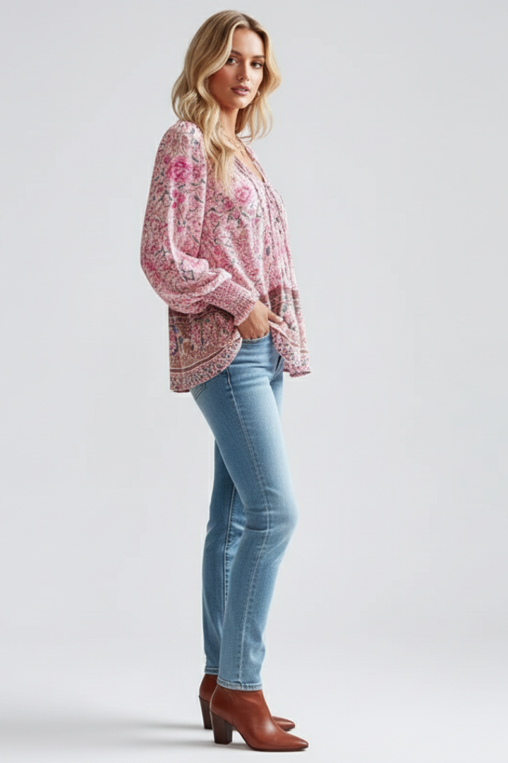 Model wears a versatile women's long sleeve floral V-neck blouse. Loose fit, comfortable for spring & summer.