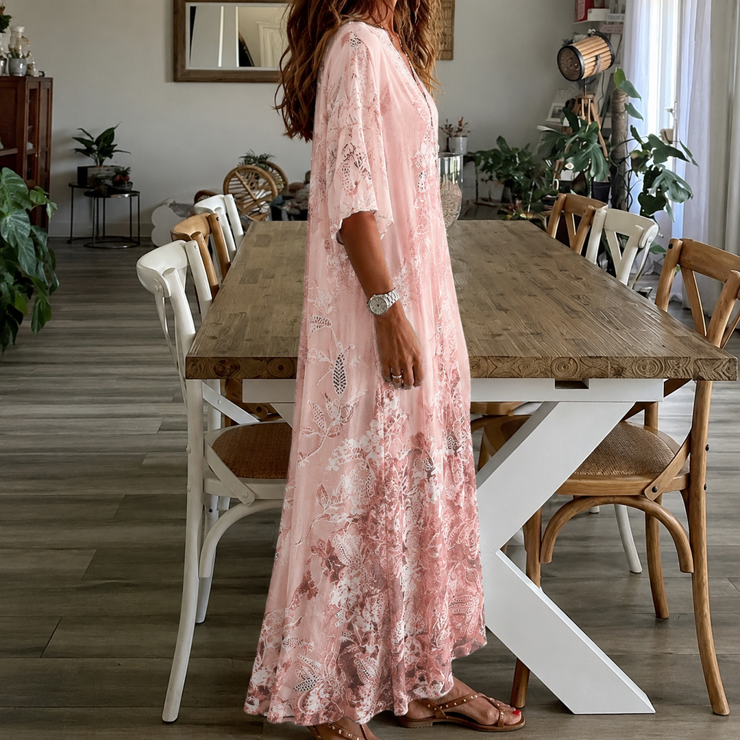 Elegant women's pink floral split-neck maxi dress with half sleeves, great for summer events.