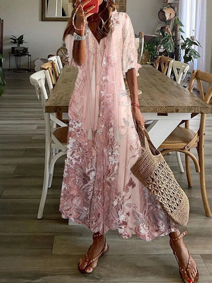 Women's pink floral print maxi dress with V-neck, half sleeves & loose fit. Perfect for summer, vacation & casual wear.