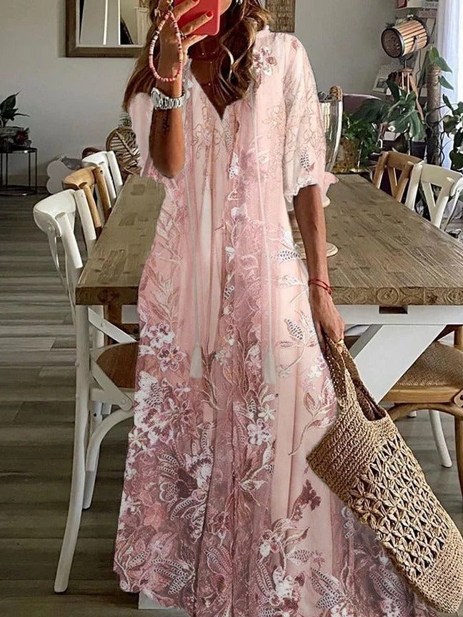 Elegant women's loose fit floral maxi dress, featuring V-neck, half sleeves. Ideal for spring, summer & vacation style.