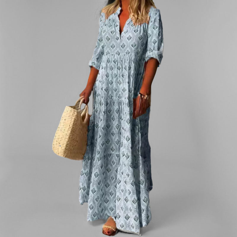 Elegant green flowing tiered maxi dress for women, with a chic V-neck. A comfortable and stylish choice for any summer day.