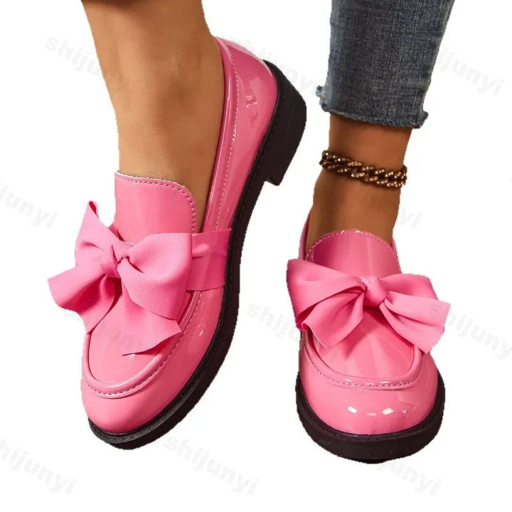 Elegant women's slip-on loafers with orthopedic arch support & a comfortable block heel for daily wear.