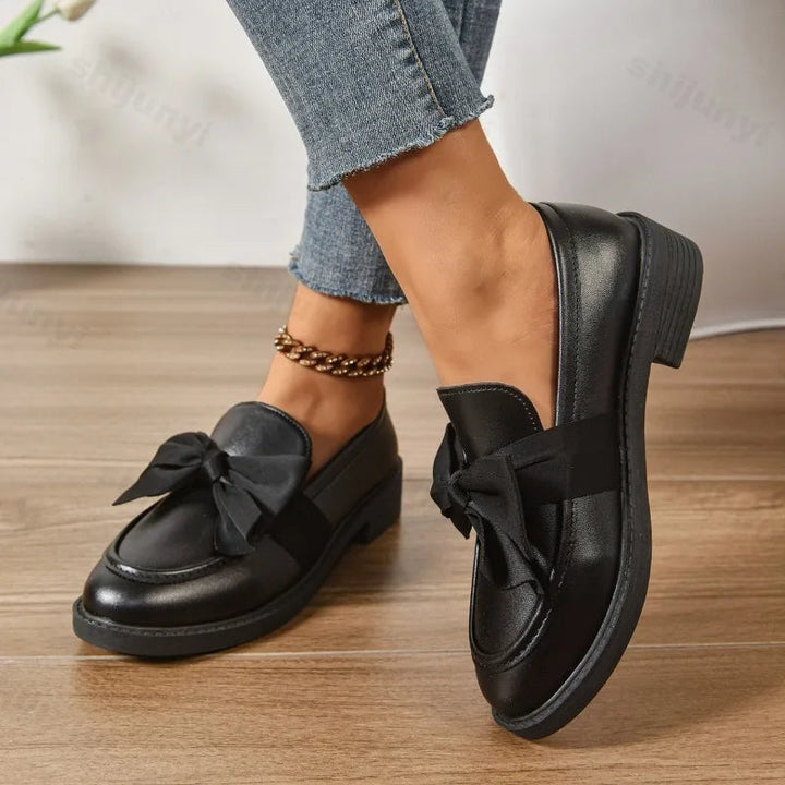 Stylish women's orthopedic comfort heels, pink loafers with arch support & a stable block heel for work.
