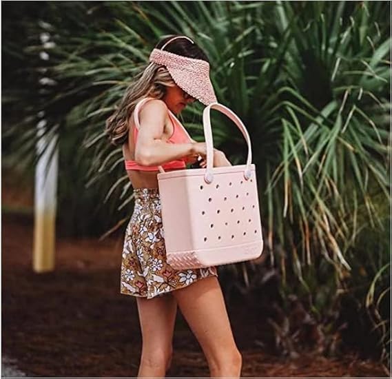 Women's pink washable EVA beach tote with vent holes for sand & water drainage.