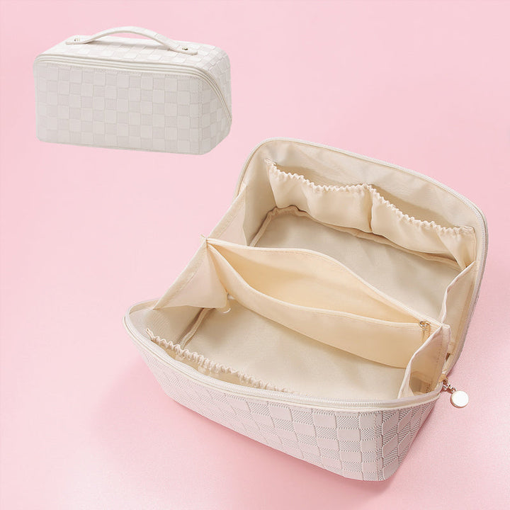 Waterproof women's cosmetic bag in a durable plaid design, easy to clean.