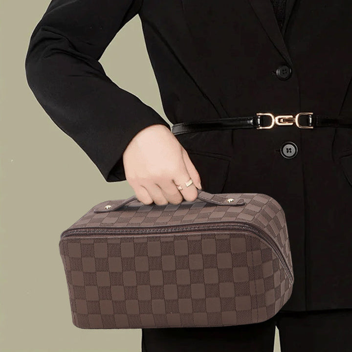 Stylish women's travel cosmetic bag with classic plaid pattern, durable and waterproof.