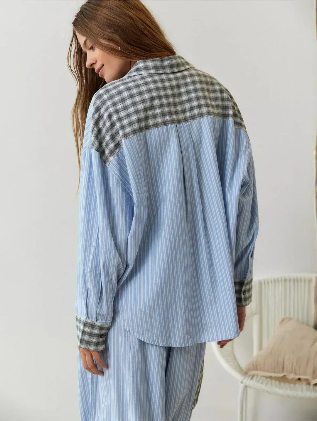 Women's plaid button-up pajama set, perfect cozy loungewear for relaxing at home or sleeping comfortably.