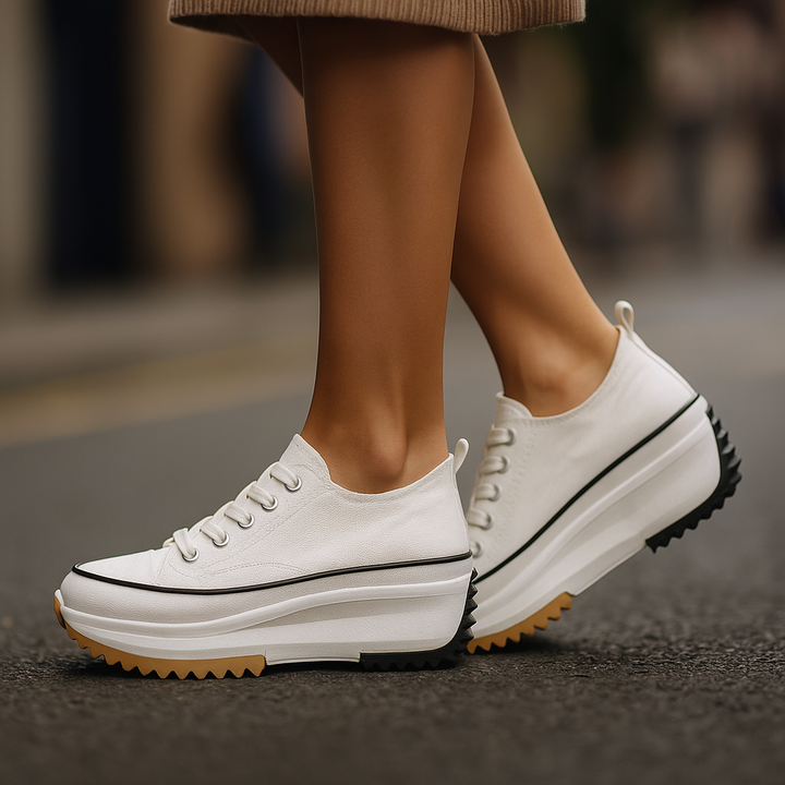 Lace-up women's platform sneakers in white, featuring orthopedic comfort and shock-absorbing design for casual fashion.