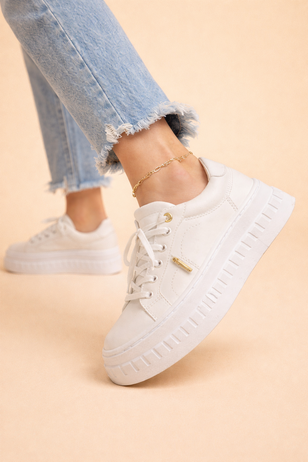 White women's platform sneakers featuring a soft cushioned sole & secure lace-up closure for ultimate comfort & style.