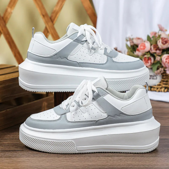 Comfortable women's platform lace-up sneakers with chic perforated details. Trendy everyday footwear.