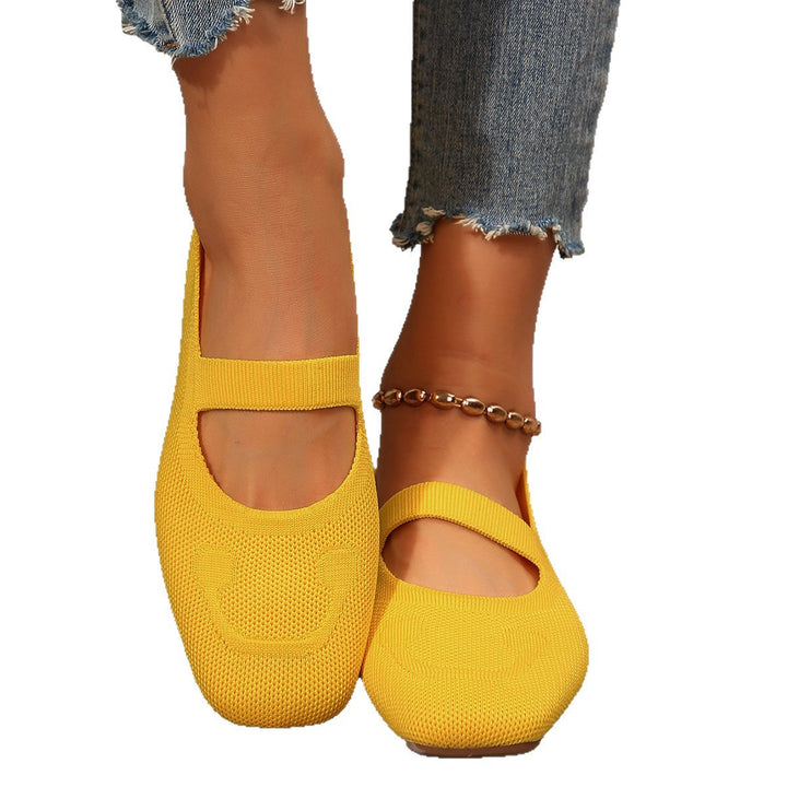 Women's comfortable Mary Jane ballet flats, styled with a charming smiling face detail & adjustable strap.