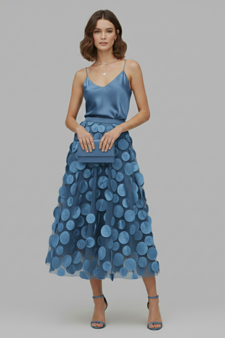 Elegant women's playful polka dot full midi skirt. Stylish fashion featuring a comfortable elastic waist.