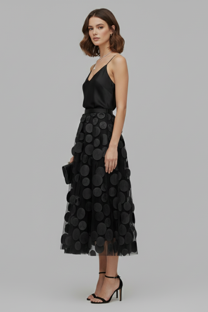 Detail of comfortable elastic waist on a women's playful polka dot full midi skirt. Elegant women's fashion.