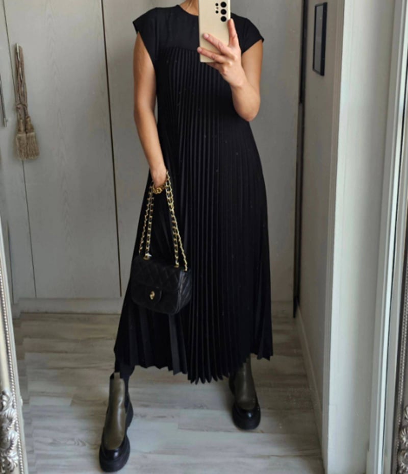 Special occasion women's pleated maxi dress with elegant extended cap sleeves & empire waist.