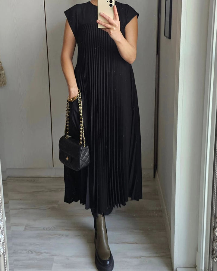 Graceful pleated maxi dress for women, comfortable extended cap sleeves & flattering empire waist.
