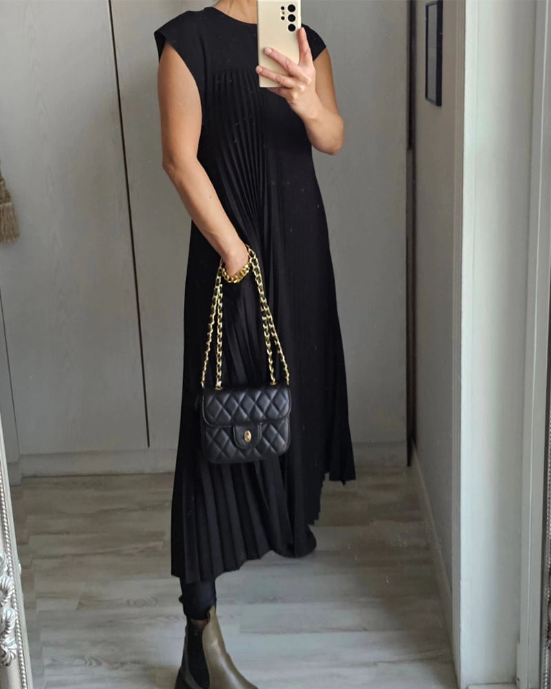 Women's stylish pleated maxi dress, extended cap sleeves & relaxed empire waist for a flattering fit.