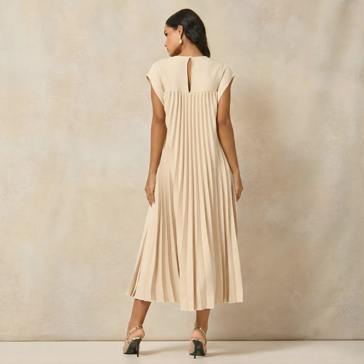Flowy women's empire waist maxi dress with pleats and comfy extended cap sleeves.