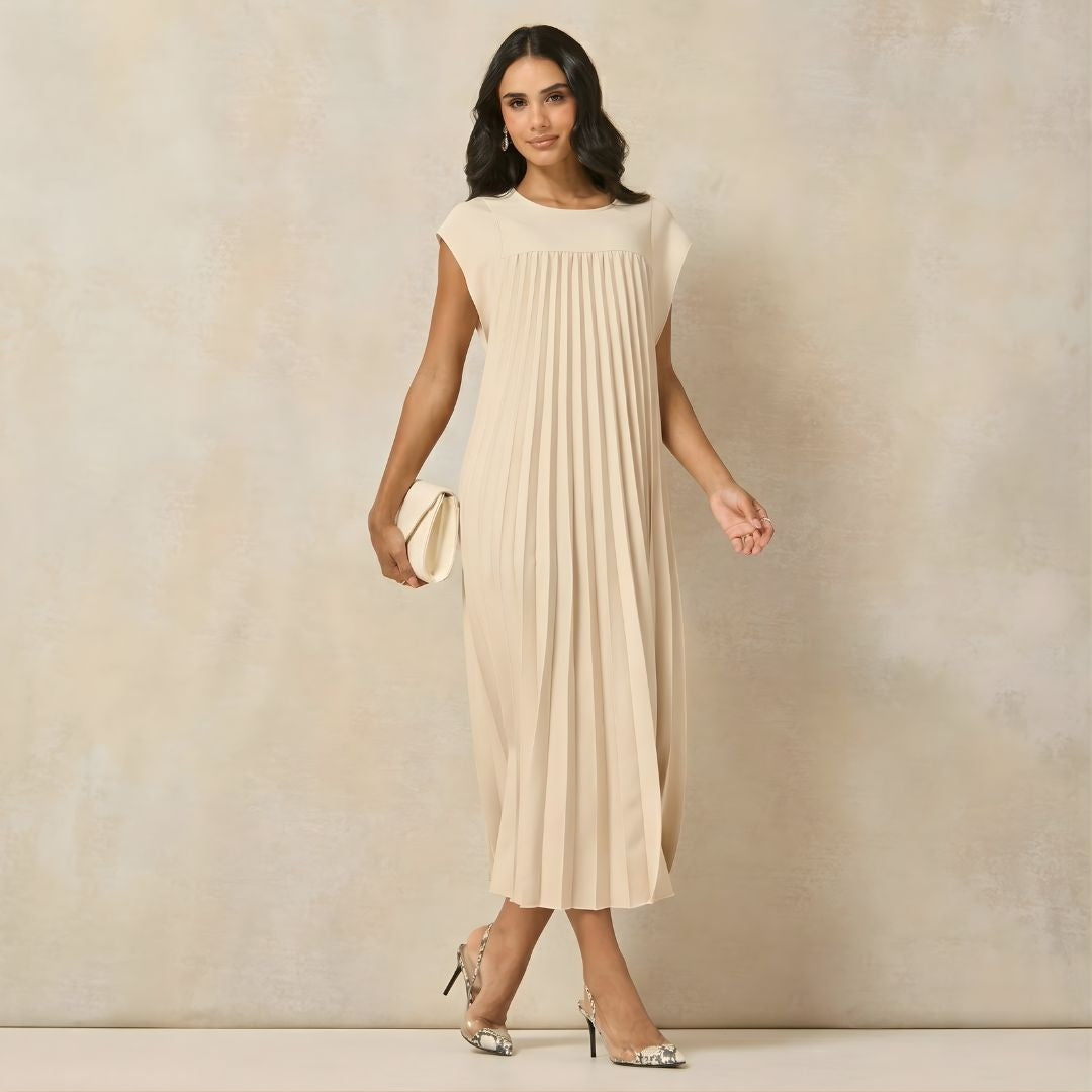 Modest pleated maxi dress for women, featuring elegant extended cap sleeves & empire waist.