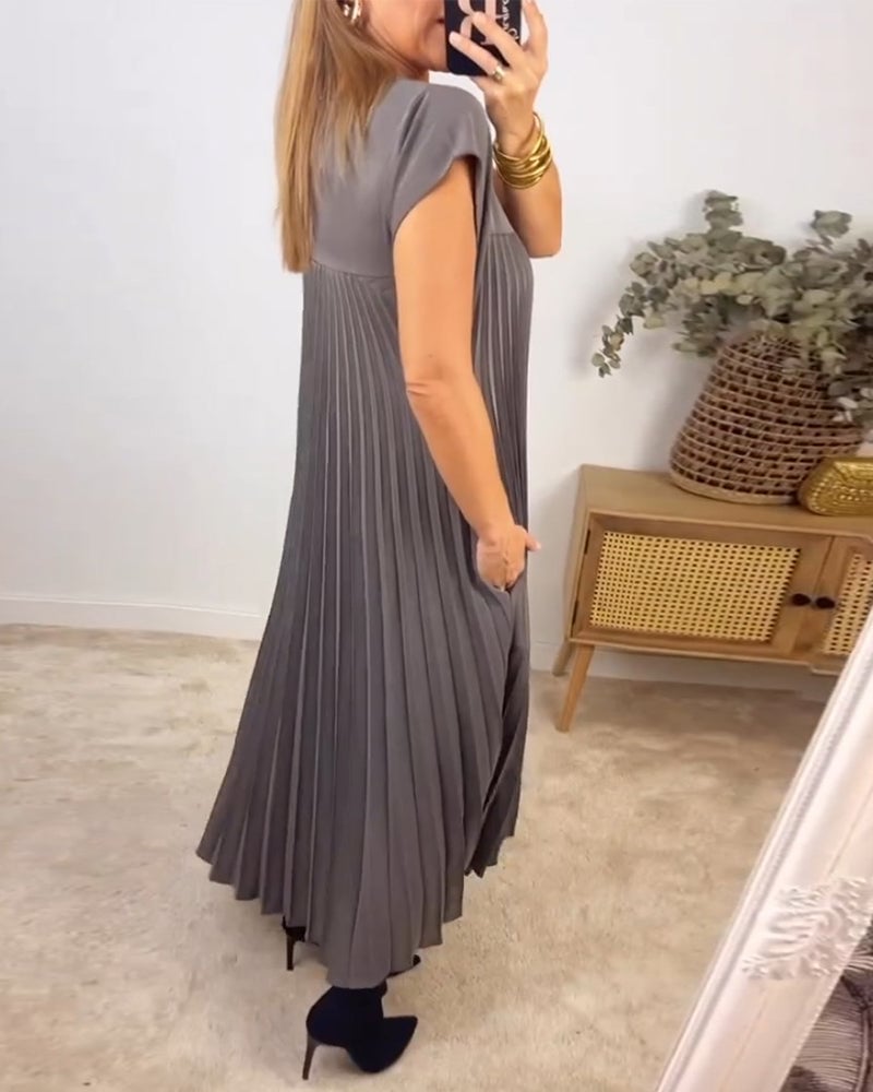 Women's pleated maxi dress, extended cap sleeves, relaxed empire waist. Elegant & flowy.