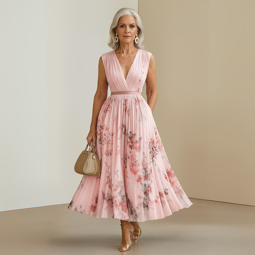 Women's sleeveless pleated maxi vacation dress, light and airy, perfect for summer travel.