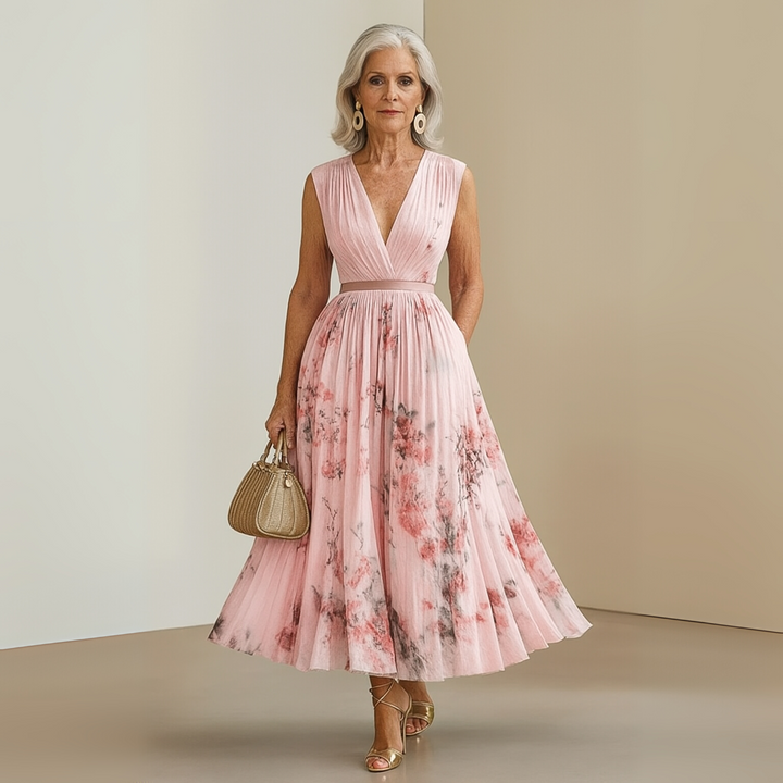 Women's sleeveless pleated maxi vacation dress, light and airy, perfect for summer travel.