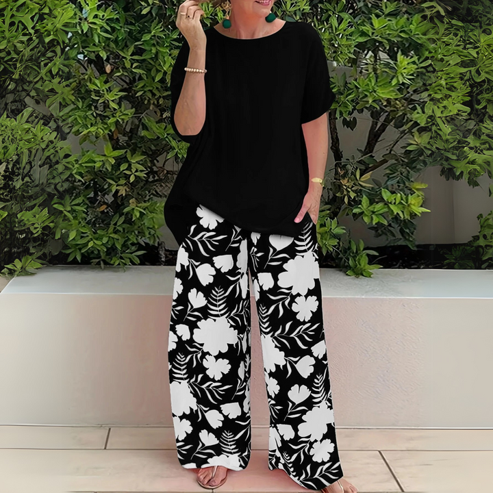 Comfortable plus size women's floral print two-piece loungewear set with elegant wide-leg pants for summer.