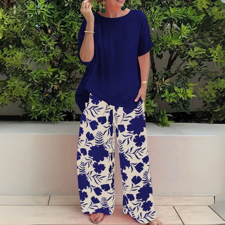 Stylish plus size women's floral print two-piece set, ideal for spring fashion & comfortable elegant wear.