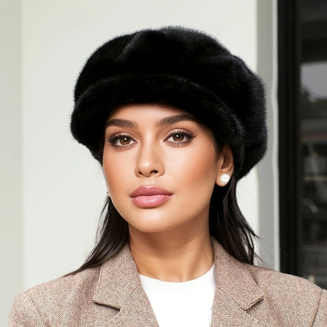 Plush faux fur women's cap in a stylish design, providing warmth and fashion for winter.