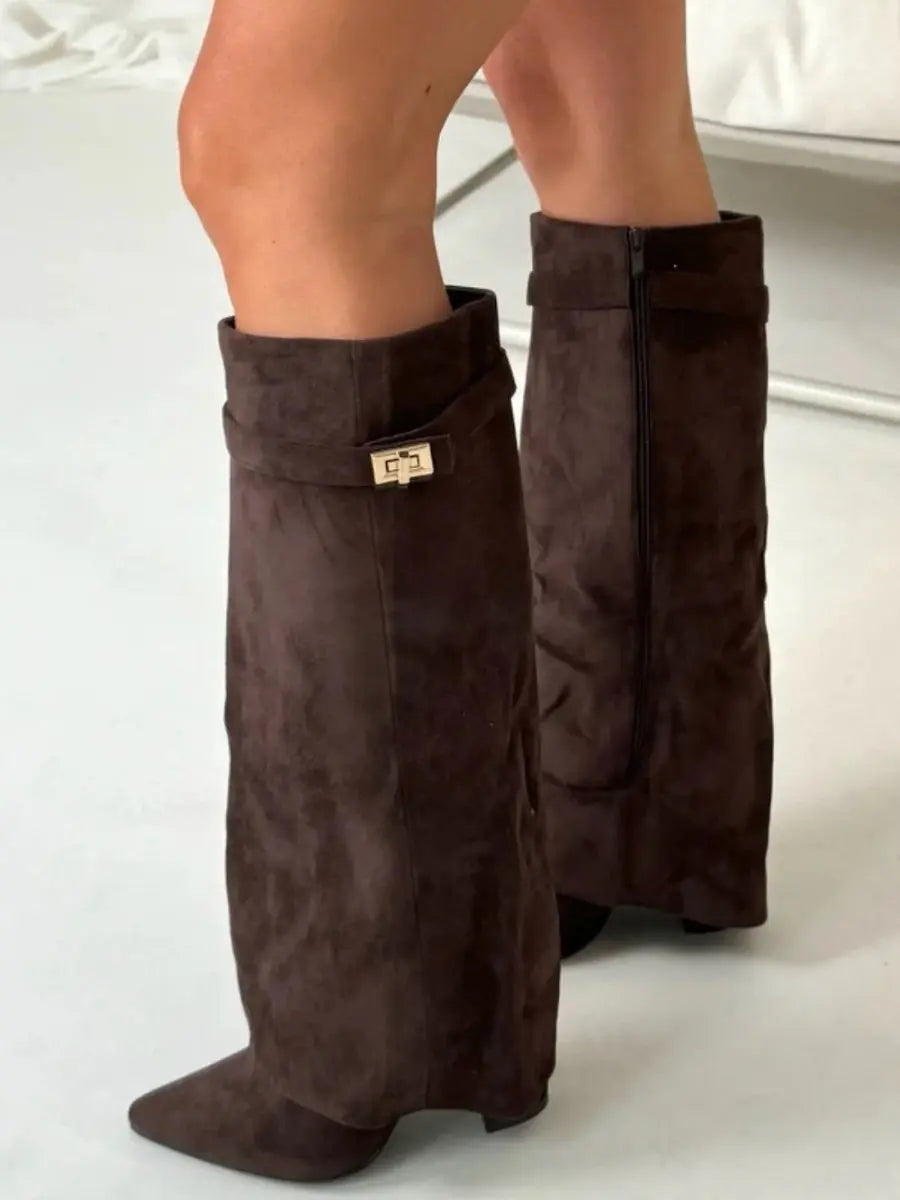 Detailed view of the material on women's pointed wedge knee-high boots, high-quality finish.