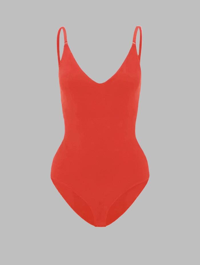 Supportive women's shapewear bodysuit offering tummy control & posture correction.