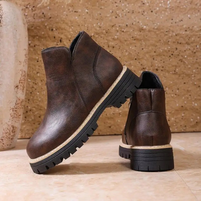 Casual yet chic women's black leather ankle boots, designed for comfort and durability in winter months.