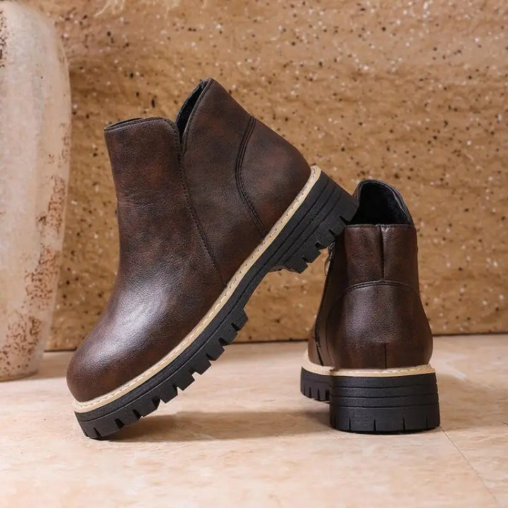 Casual yet chic women's black leather ankle boots, designed for comfort and durability in winter months.