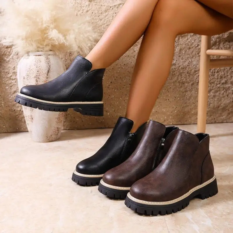 Women's versatile black leather ankle boots, ideal for everyday wear and enhancing fall outfits.