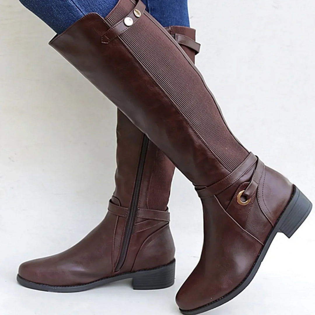 Orthopedic women's black leather boots, ankle height, offering comfort and support for casual winter outfits.