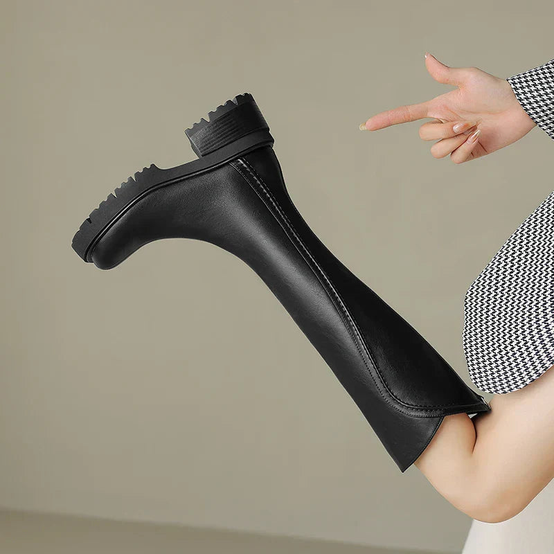 Close-up of the textured leather on women's premium orthopedic boots, highlighting craftsmanship.